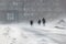 Blizzard bad weather snow and strong wind in the city selective focus