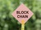 Block chain with Blockchain word from colorful sticks on green background