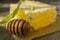 Block of comb honey with linden flower and utensil