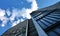 Block of flats with blue sky and clouds, urban building, real estate concept. Council tower block. Expensive prices for flats.