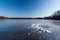 Block of ice lying on the surface of a frozen pond