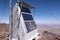 A block of solar panels to supply electrical power to a cellular tower at a remote location.