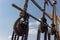 Block and tackle rigging on an old tall ship before blue sky, spliced and wrapped rope lines