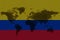 Blockchain world map on the background of the flag of colombia and cracks. colombia cryptocurrency concept