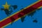 Blockchain world map on the background of the flag of congo and cracks. congo cryptocurrency concept
