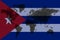Blockchain world map on the background of the flag of cuba and cracks. cuba cryptocurrency concept