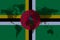Blockchain world map on the background of the flag of Dominica and cracks. Dominica cryptocurrency concept