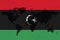 Blockchain world map on the background of the flag of Libya and cracks. Libya cryptocurrency concept