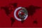 Blockchain world map on the background of the flag of Tunisia and cracks. Tunisia cryptocurrency concept