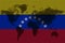 Blockchain world map on the background of the flag of Venezuela and cracks. Venezuela cryptocurrency concept
