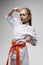 Blocking punches of little girl in kimono, karate session