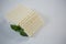 Blocks of cheese with herbs on white background