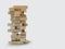 Blocks wood game jenga on gray background.