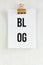 Blog Clipboard, conceptual communication. on white wooden background