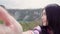 Blogger Asian backpacker woman record vlog video on top of mountain, young female happy using mobile phone make vlog video enjoy