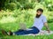 Blogger becoming inspired by nature. Looking for inspiration. Man bearded with laptop relaxing meadow nature background