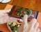 Blogger of food smartphone picture which Woman hands takes photography by smartphone of salad
