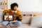 Blogger guitarist. African american girl blogger playing guitar talking to webcam recording vlog. Social media
