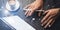 Blogger using mobile touch pad for work at social network message.Closeup view of male hands using stylus pen for