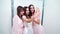 Blogger in wedding dress and bridesmaids streaming from salon