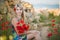 Blond adoreable lady woman wearing stylish summer colourful dress posing with adoreable sensual body on sea side beach with bouque