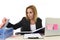 Blond attractive 40s woman in business suit working at laptop co