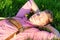 Blond bavarian man sleeping in the grass