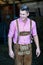 Blond bavarian man standing at barn