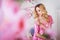 Blond beautiful woman in pink dressing gown