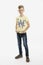 A blond boy in jeans and a yellow T-shirt stands. White background. Vertical. Full height