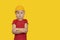 Blond boy in protective helmet on yellow background. Choice of future profession