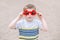 Blond Caucasian boy wearing funny Canadian sunglasses with maple leaf. Child kid celebrating Canada Day