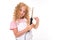 Blond caucasian girl twists her hair with a hair curler on a white background