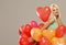 Blond cheerful woman with red balloons heart