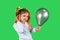 A blond child holding a ultimate gray balloon, with her hand to ear listening to your advertisement