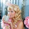 Blond fashion princess woman drinking tea