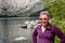 Blond female poses by Convict Lake in the springtime, located off of US-395, near Mammoth Lakes California in the eastern Sierra