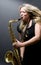 blond female saxophone player musician