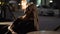 blond female sitting in restaurant and waiting for someone, evening time