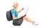 Blond female student working on a laptop and sitting on a floor