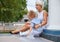 Blond female in white dress and her cute little child.