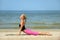 Blond female workout on the beach