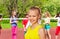 Blond girl and friends playing volleyball behind