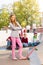 Blond girl in front with skateboard and friends