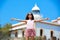 Blond girl open hands in Mediterranean Lighthouse