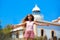 Blond girl open hands in Mediterranean Lighthouse