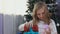 Blond girl opens present in the Christmas morning