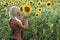 The blond girl painting the sunflower