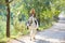 Blond girl woman riding a white horse in track