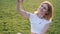 Blond gorgeous woman is taking selfie on the green background